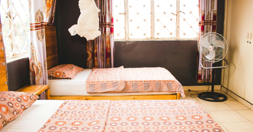 Platform bed in cozy room with fan